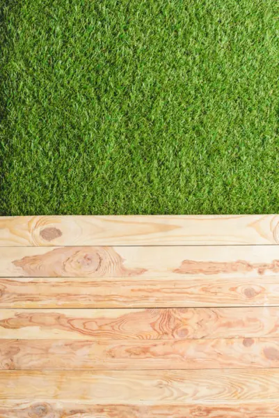 top view of green lawn and wooden planks backgroun 2024 11 17 07 29 29 utc 1 1