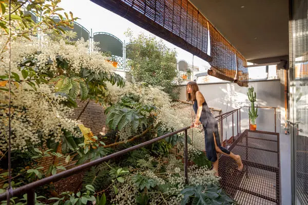 woman relaxing on green balcony 2025 03 13 01 40 38 utc 1 1