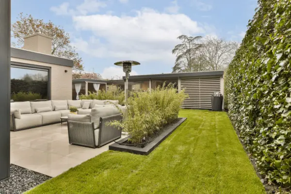 a yard with a couch and a table in front 2025 02 09 22 36 45 utc 1 1