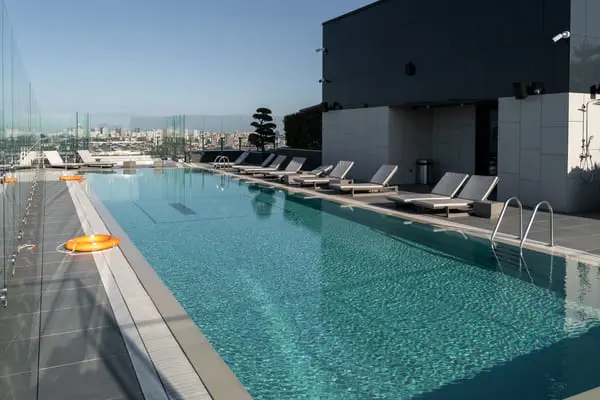 large modern pool with sunbeds and lifebuoys the 2024 10 22 01 13 19 utc