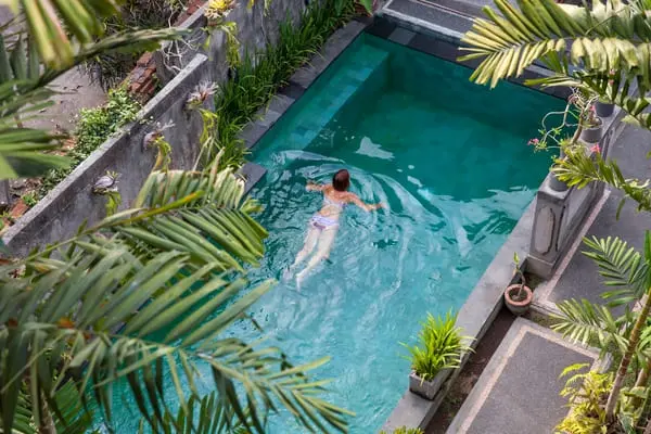 young woman swimming in the pool in ubud bali vi 2025 03 09 07 11 47 utc 1 1