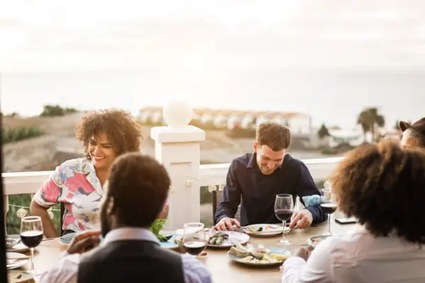 happy multiracial friends having dinner and drinki 2025 02 22 02 56 47 utc 1 1